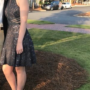 Short formal dress in gun metal. Dry cleaned.